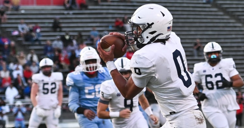 East Lansing's Jace Clarizio (Michigan State signee) snags a pass against Everett, Friday, Oct. 11, 2024, which he ran in for a Trojan TD. East Lansing won 39-26. - Matthew Dae Smith, USA TODAY Sports
