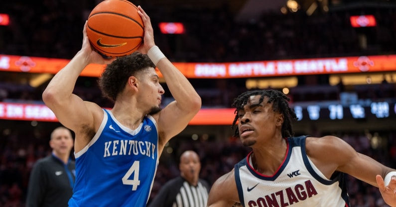 Dec 7, 2024; Seattle, Washington, USA; Kentucky Wildcats guard Koby Brea (4) drives against Gonzaga Bulldogs guard Michael Ajayi (1) during the second half at Climate Pledge Arena. Mandatory Credit: Stephen Brashear-Imagn Images