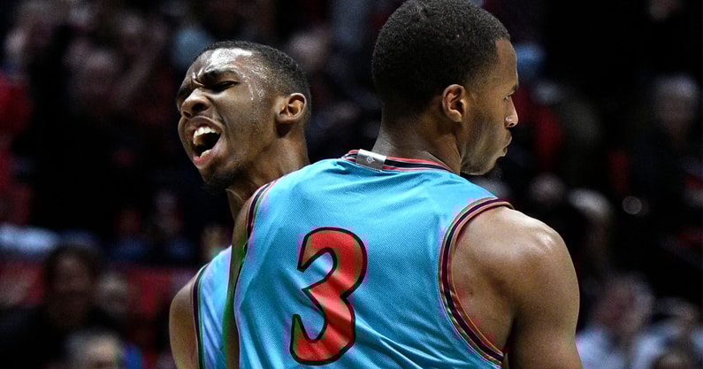 Nov 14, 2023; San Diego, California, USA; San Diego State Aztecs guard Micah Parrish (3) celebrates with guard Lamont Butler (rear) after a basket against the Long Beach State 49ers during the first half at Viejas Arena. Mandatory Credit: Orlando Ramirez-Imagn Images