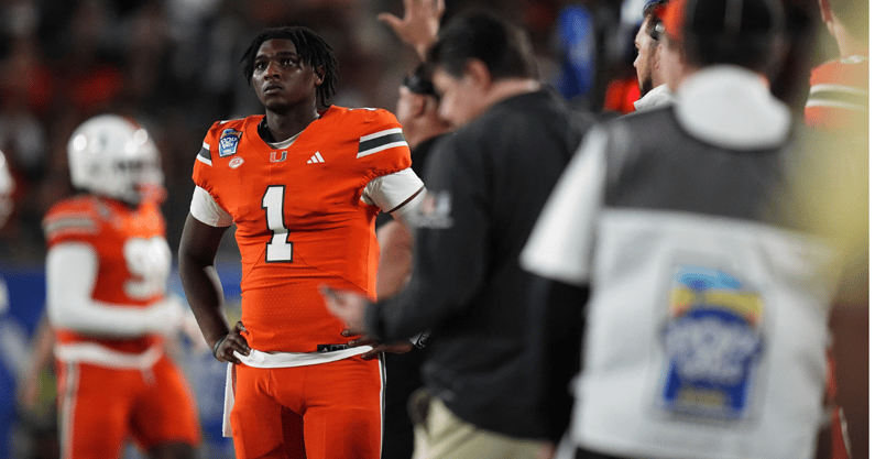 Miami QB Cam Ward on the sideline of the Pop-Tarts Bowl