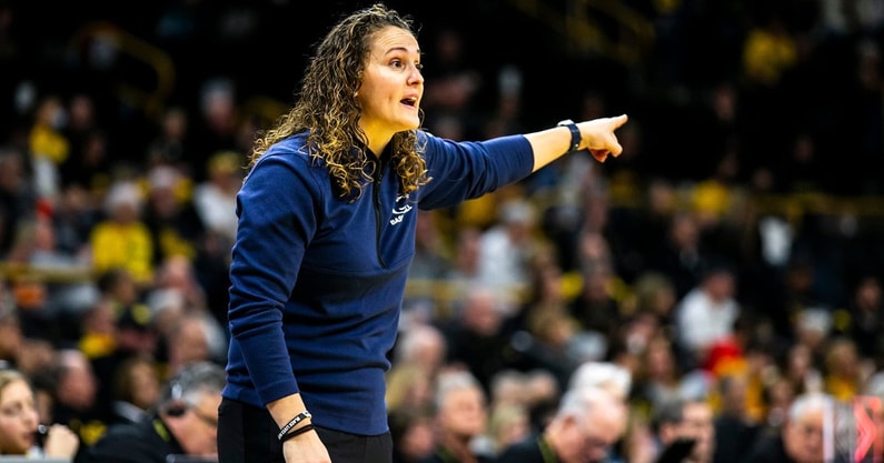 Penn State head coach Carolyn Kieger calls out instructions during a game against Iowa. (Photo by HawkCentral)