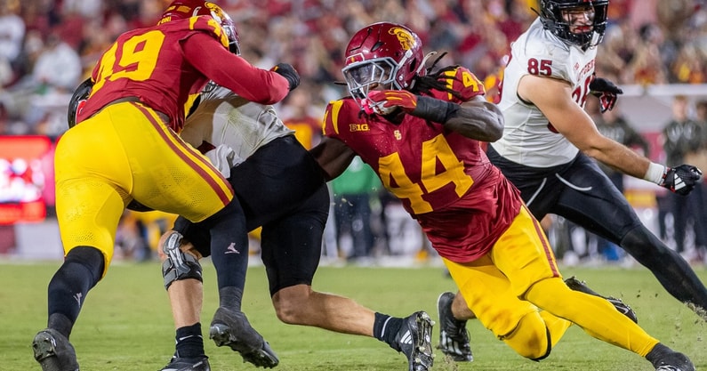 USC defensive ends Kameryn Fountain and Sam Greene combine on a tackle for the Trojans during a game against the Rutgers Scarlet Knights (acscottphotography/WeAreSC)