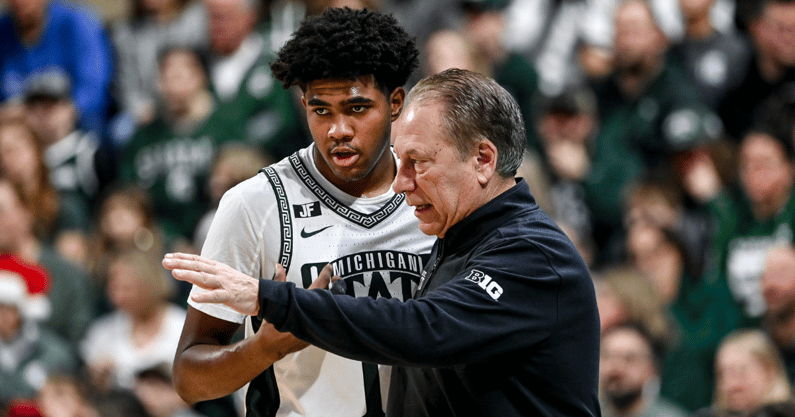 Michigan State's Jase Richardson, left, talks with head coach Tom Izzo during a break in the action in the game against Florida Atlantic on Saturday, Dec. 21, 2024, in East Lansing - Nick King, USA TODAY Sports