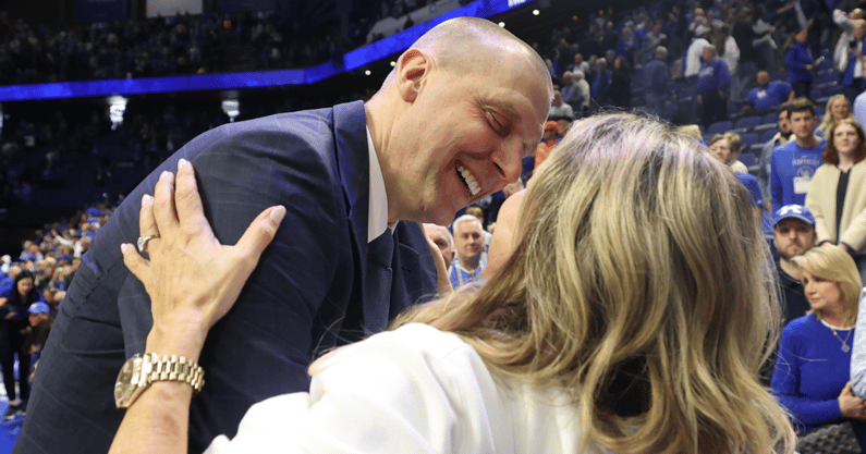 Mark Pope embraces his wife Lee Anne after Kentucky's win over Florida - Dr. Michael Huang, Kentucky Sports Radio