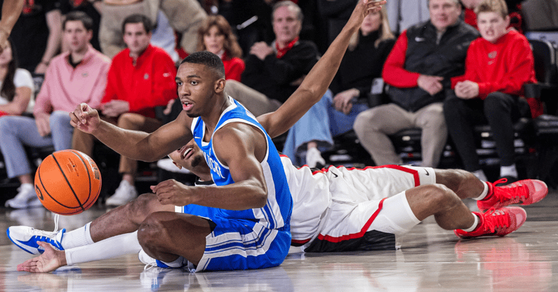 Kentucky Wildcats guard Lamont Butler (1) tries to grab a loose ball behind Georgia Bulldogs - Dale Zanine, Imagn Images