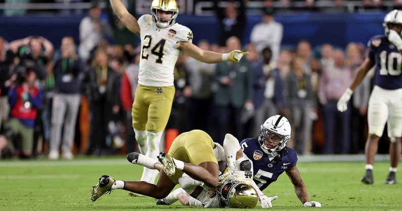 Notre Dame Fighting Irish cornerback Christian Gray (29) intercepts the ball in front of Penn State Nittany Lions wide receiver Omari Evans (5) in the second half in the Orange Bowl at Hard Rock Stadium. (Mandatory Credit: Nathan Ray Seebeck-Imagn Images)