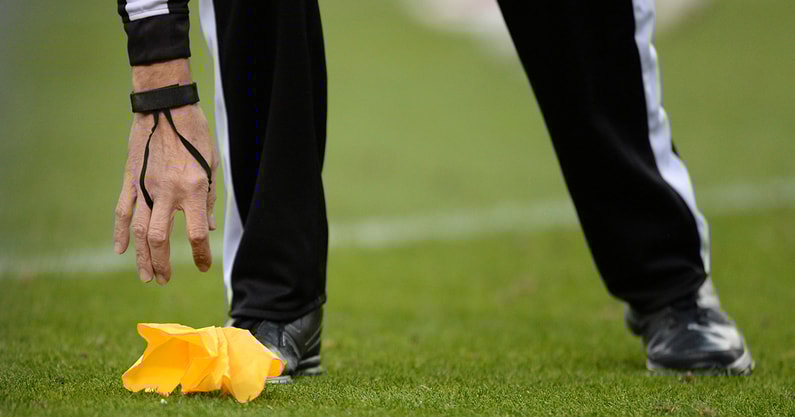 NFL referee picks up a flag