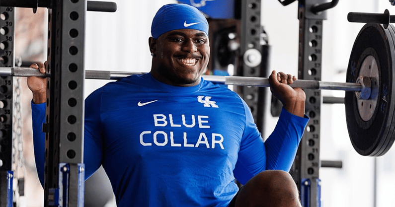 Kentucky football player in the weight room