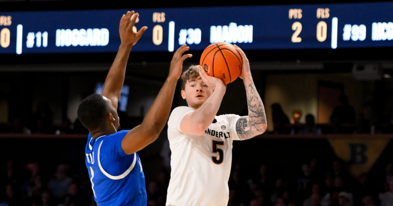 Jan 25, 2025; Nashville, Tennessee, USA; Vanderbilt Commodores guard Tyler Nickel (5) shoots a three point basket against the Kentucky Wildcats during the first half at Memorial Gymnasium. Mandatory Credit: Steve Roberts-Imagn Images
