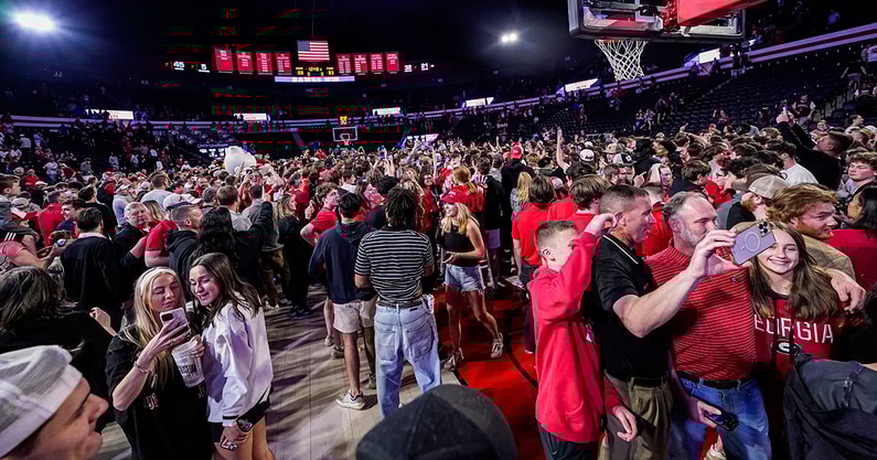 Georgia fans storm the court after defeating Florida