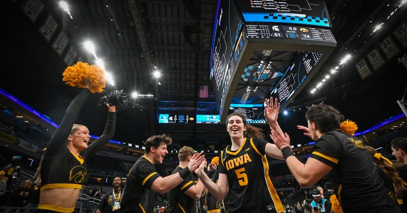 Iowa center Ava Heiden exits the court after a win over Michigan State at the Big Ten Tournament. (Photo by Dennis Scheidt)
