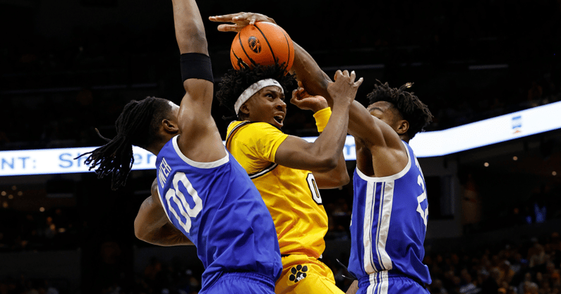 Mar 8, 2025; Columbia, Missouri, USA; Kentucky Wildcats guard Otega Oweh (00) and center Amari Williams (22) block the shot by Missouri Tigers guard Anthony Robinson II (0) in the first half at Mizzou Arena. Mandatory Credit: Gary Rohman-Imagn Images