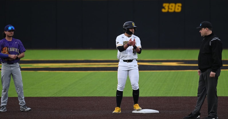 Iowa first baseman Caleb Wulf stands on second base against Loras College. (Photo by Dennis Scheidt)
