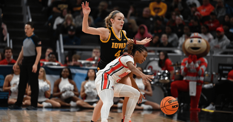 Iowa guard Kylie Feuerbach defends a Buckeye ballhandler at the Big Ten Tournament. (Photo by Dennis Scheidt)