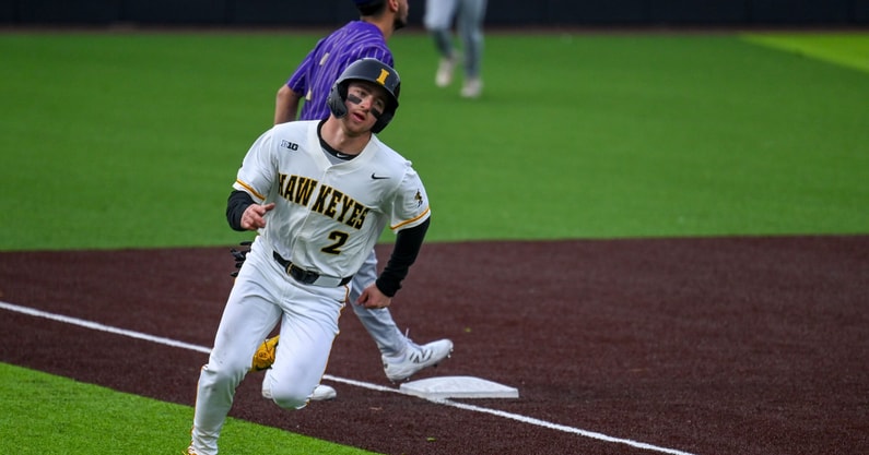 Iowa infielder Gable Mitchell comes around the score against Loras College. (Photo by Dennis Scheidt)