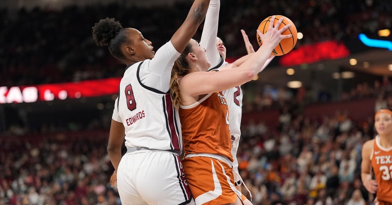exas Longhorns forward Taylor Jones (44) goes up for a shot surrounded by South Carolina Gamecocks forward Joyce Edwards (8) and forward Chloe Kitts (21) during the first half at Bon Secours Wellness Arena. Mandatory Credit: Jim Dedmon-Imagn Images