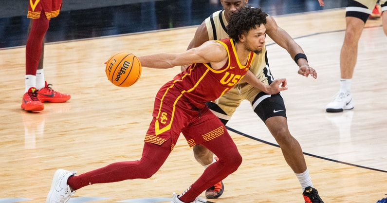 USC Trojans guard Desmond Claude (1) dribbles the ball while Purdue Boilermakers guard Myles Colvin (5) defends in the second half at Gainbridge Fieldhouse