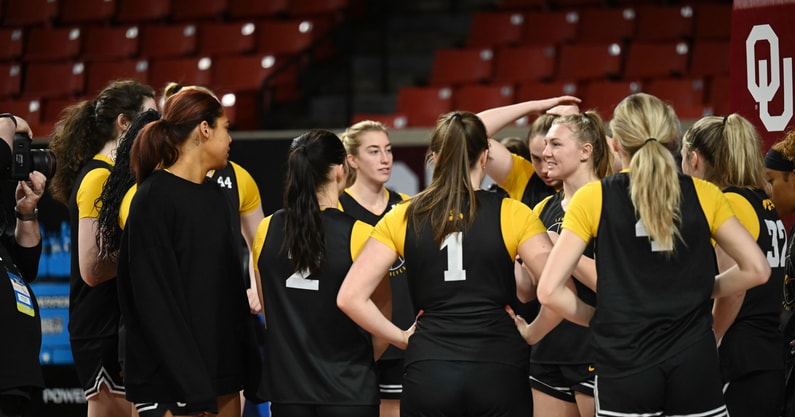 The Iowa Women's Basketball team huddles prior to their pre-tournament practice in Norman. (Photo by Dennis Scheidt)