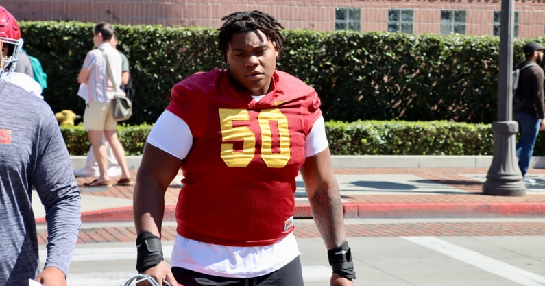USC center J'Onre Reed walks out to a practice with the Trojans