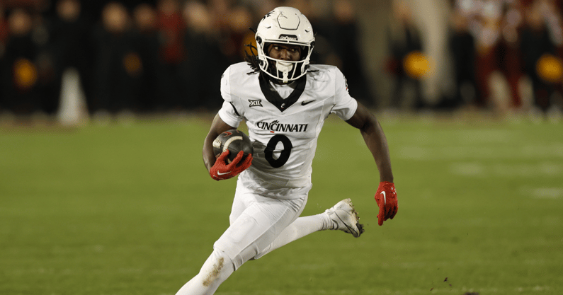 Nov 16, 2024; Ames, Iowa, USA; Cincinnati Bearcats wide receiver Tony Johnson (0) runs for a first down against the Iowa State Cyclones in the second half at Jack Trice Stadium. The Iowa State Cyclones won the game 34-17. Mandatory Credit: Reese Strickland-Imagn Images