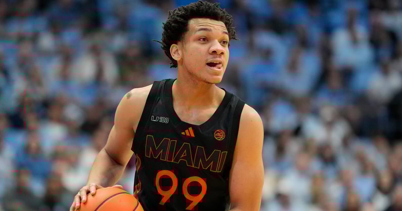 Mar 1, 2025; Chapel Hill, North Carolina, USA; Miami (Fl) Hurricanes guard Divine Ugochukwu (99) with the ball in the first half at Dean E. Smith Center. Mandatory Credit: Bob Donnan-Imagn Images