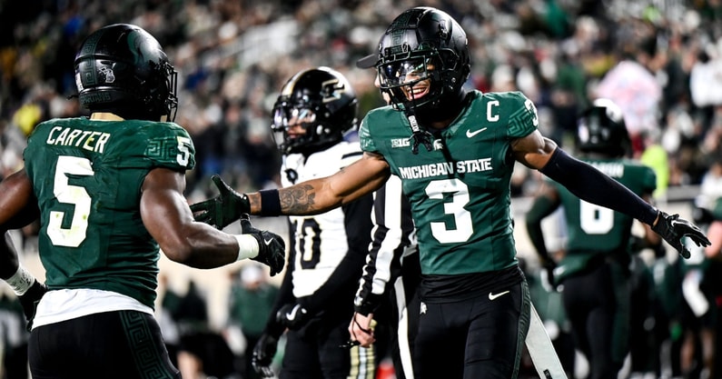 Michigan State's Montorie Foster Jr., right, celebrates with Nathan Carter, left, after Carter's touchdown against Purdue during the second quarter on Friday, Nov. 22, 2024, at Spartan Stadium - Nick King, USA TODAY Sports