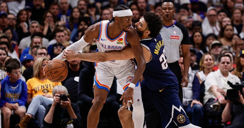 May 11, 2025; Denver, Colorado, USA; Oklahoma City Thunder guard Shai Gilgeous-Alexander (2) controls the ball under pressure from Denver Nuggets guard Jamal Murray (27) in the fourth quarter during game four of the second round of the 2025 NBA Playoffs at Ball Arena. Mandatory Credit: Isaiah J. Downing-Imagn Images