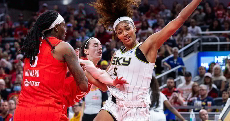 Chicago Sky forward Angel Reese fouled by Caitlin Clark