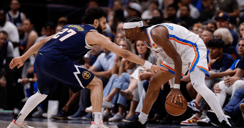 May 11, 2025; Denver, Colorado, USA; Oklahoma City Thunder guard Shai Gilgeous-Alexander (2) controls the ball as Denver Nuggets guard Jamal Murray (27) guards in the third quarter during game four of the second round of the 2025 NBA Playoffs at Ball Arena. Mandatory Credit: Isaiah J. Downing-Imagn Images