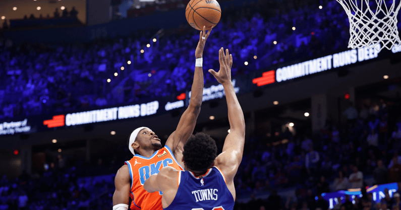 Jan 3, 2025; Oklahoma City, Oklahoma, USA; Oklahoma City Thunder guard Shai Gilgeous-Alexander (2) shoots as New York Knicks center Karl-Anthony Towns (32) defends during the second half at Paycom Center. Mandatory Credit: Alonzo Adams-Imagn Images