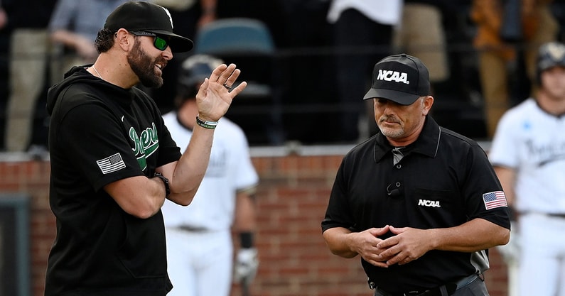 Wright State baseball coach Alex Sogard talks to an umpire vs. Vanderbilt