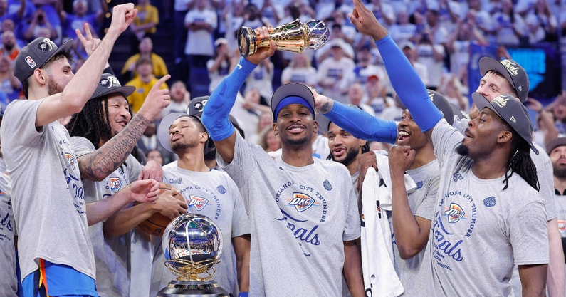 May 28, 2025; Oklahoma City, Oklahoma, USA; Oklahoma City Thunder guard Shai Gilgeous-Alexander holds up the MVP trophy for the western conference finals for the 2025 NBA Playoffs at Paycom Center. Mandatory Credit: Alonzo Adams-Imagn Images