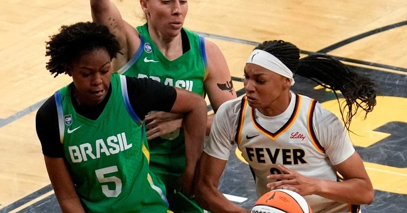 Indiana Fever forward-center Makayla Timpson (21) tries to gather the ball as Brazil's Ayla McDowell (5) defends during an WNBA game May 4, 2025 at Carver-Hawkeye Arena in Iowa City, Iowa.
