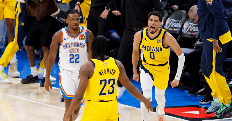 Jun 5, 2025; Oklahoma City, Oklahoma, USA; Indiana Pacers guard Tyrese Haliburton (0) and forward Aaron Nesmith (23) celebrate after Haliburton makes the game winning shot as Oklahoma City Thunder guard Cason Wallace (22) looks on during the fourth quarter during game one of the 2025 NBA Finals at Paycom Center. Mandatory Credit: Alonzo Adams-Imagn Images