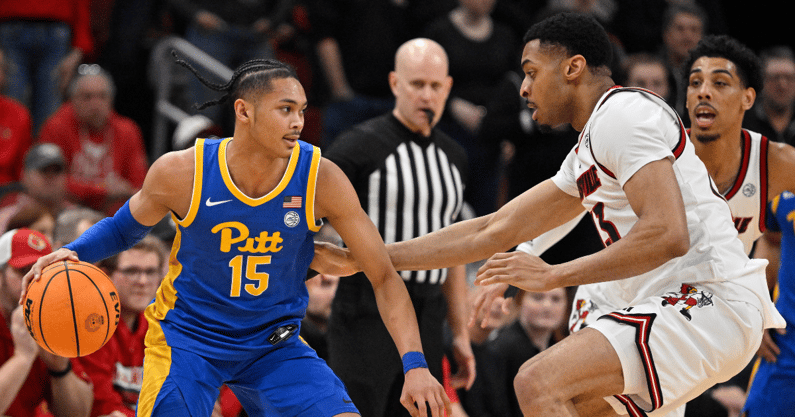 Mar 1, 2025; Louisville, Kentucky, USA; Pittsburgh Panthers guard Jaland Lowe (15) dribbles against Louisville Cardinals center Frank Anselem-Ibe (13) during the second half at KFC Yum! Center. Louisville defeated Pittsburgh 79-68. Mandatory Credit: Jamie Rhodes-Imagn Images