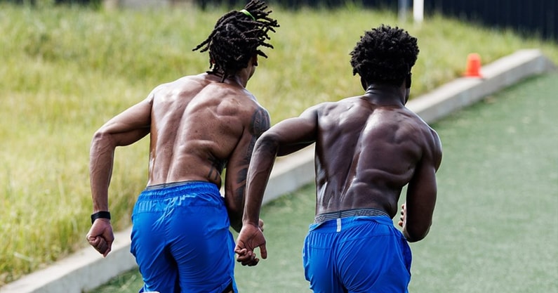 The Kentucky football team sprints hills during summer conditioning, via UK Athletics