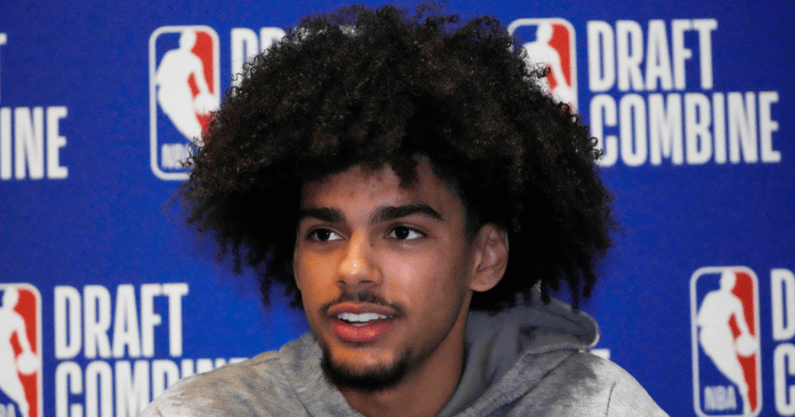 asa-newell-beams-in-jewelry-laden-slim-purple-suit-ahead-of-2025-nba-draft