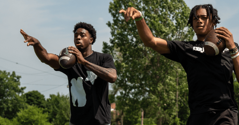 Aidan Chiles, 19, a Michigan State University quarterback, left, and Donald Tabron II, 16, a quarterback at Cass Technical High School, participate in a private workout in Detroit. - David Rodriguez Munoz, USA TODAY Sports