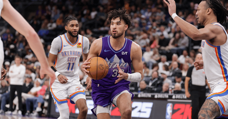 Apr 11, 2025; Salt Lake City, Utah, USA; Utah Jazz guard Johnny Juzang (33) looks to past the ball during the second half against the Oklahoma City Thunder at Delta Center. Mandatory Credit: Chris Nicoll-Imagn Images