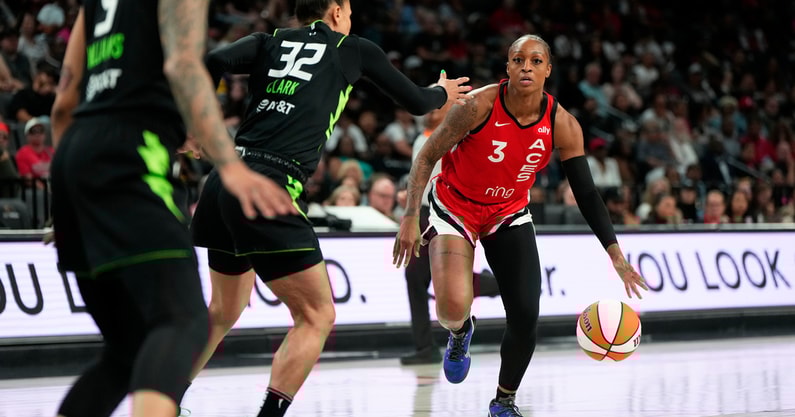 Las Vegas Aces guard Tiffany Mitchell (3) dribbles the ball against Seattle Storm forward Alysha Clark (32) during the first half of a WNBA basketball game at Michelob Ultra Arena. Mandatory Credit: Lucas Peltier-Imagn Images