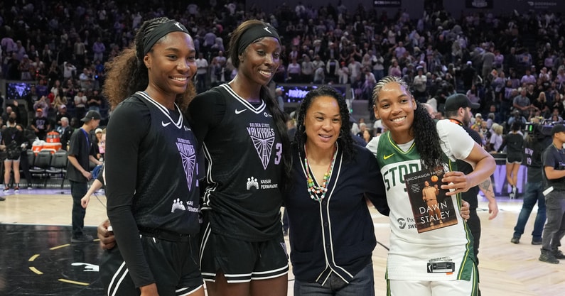 Golden State Valkyries guard Bree Hall (21) and forward Laeticia Amihere (3) pose for a photo with South Carolina Gamecocks women's basketball head coach Dawn Staley and Seattle Storm guard Zia Cooke (7) after the game at Chase Center. Mandatory Credit: Darren Yamashita-Imagn Images