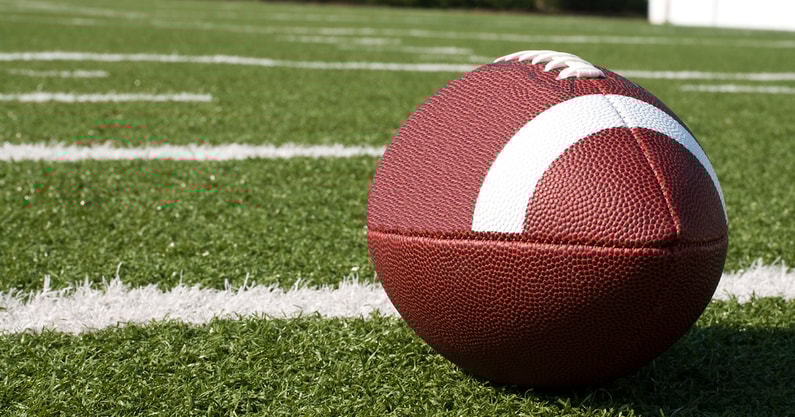 Closeup of American Football on Field