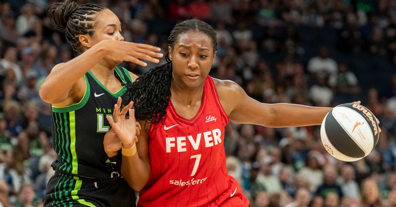 Indiana Fever forward Aliyah Boston (7) dribbles the ball past Minnesota Lynx forward Napheesa Collier (24) in the first half during the Commissioner's Cup final at Target Center. Mandatory Credit: Jesse Johnson-Imagn Images