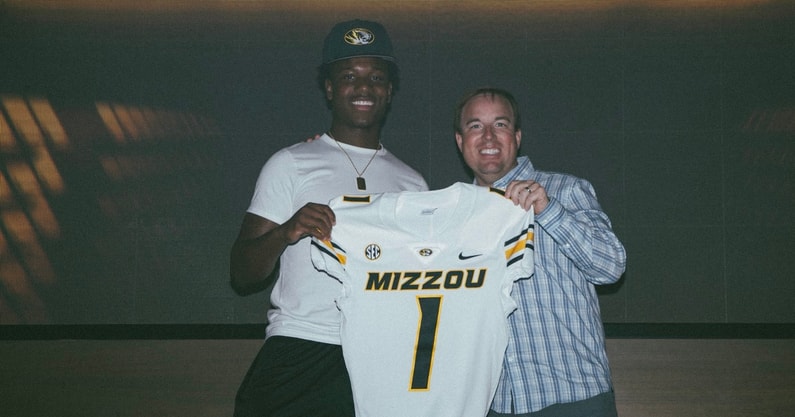 JJ Bush stands with Mizzou coach Eli Drinkwitz (Photo by Mizzou football)