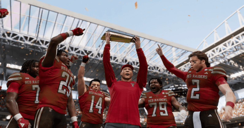 Texas Tech head coach Joey McGuire holds up national championship trophy