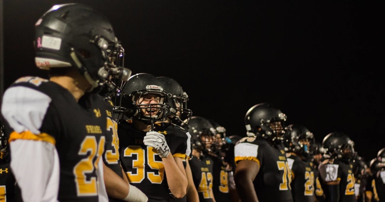 St. Anthony's Friars line up after a New York high school football game.
