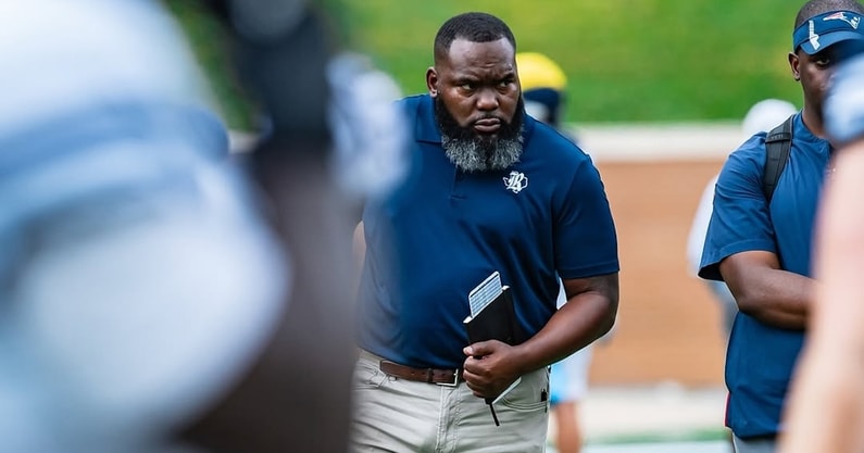 New Chisholm Trail coach Marvin Nash on the field before a Rice football game.
