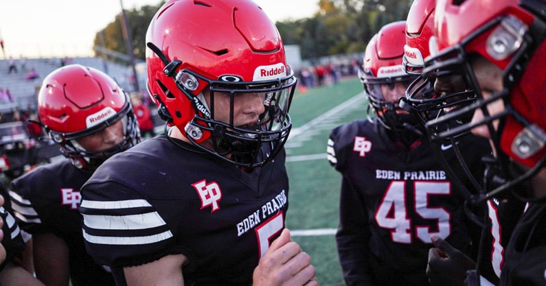 The Eden Prairie football team huddles up before a Minnesota high school football game.