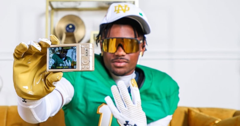 Nick Reddish poses with a camera on his Notre Dame official visit