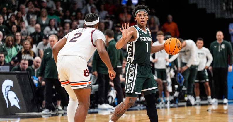 Michigan State guard Jeremy Fears Jr. (1) dribbles against Auburn guard Denver Jones (2) during the first half of the Elite Eight round of NCAA tournament at State Farm Arena in Atlanta. - Junfu Han, USA TODAY Sports